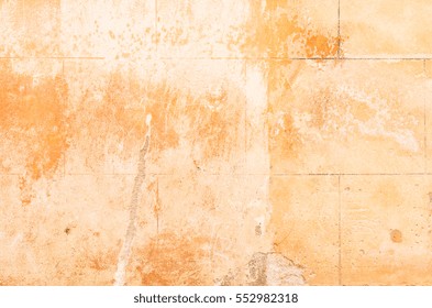 Old rustic brown stone wall background texture.