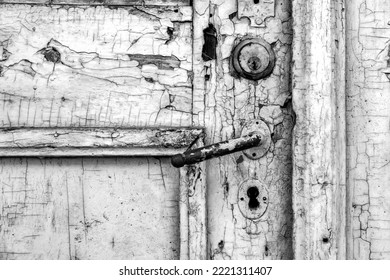 Old Rustic Door Close Up. Peeled Paint. Black And White