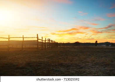 Old Rustic Fence In Fields Evening Time