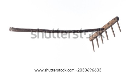 old rustic rake isolated on white background