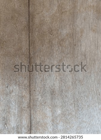 Old rustic wood panel surface texture with faded marks and natural woodgrain for grunge background or overlay design
