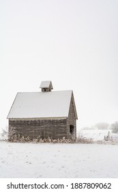 Old Rustic Wooden Barn In The Snow On A Cold And Foggy Winter Day.  LaSalle County, Illinois.