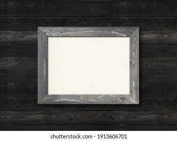 Old Rustic Wooden Picture Frame Hanging On A Black Wood Wall. Horizontal Picture. Blank Mockup Template