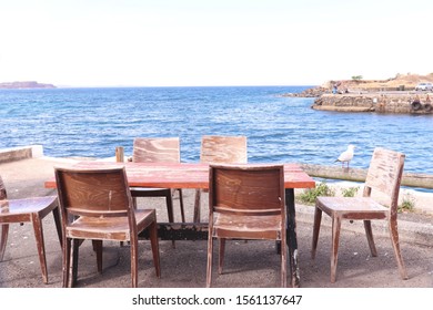 Old Rustic Wooden Table Restaurant With Sea View Blue Water White Sky No Body Coastal Photography 