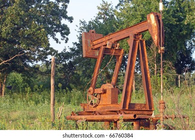 Old, Rusty, Abandoned Oil Pump At A Dry Well In Oklahoma.