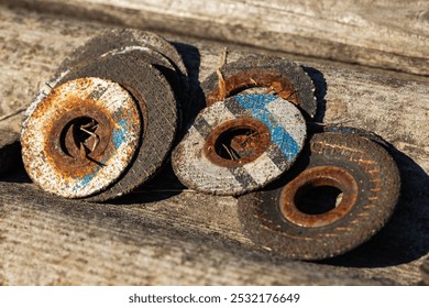 Old rusty abrasive cutting discs for metalworking. Close up. - Powered by Shutterstock