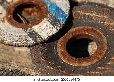 Old rusty abrasive cutting discs for metalworking. Close up. - Powered by Shutterstock