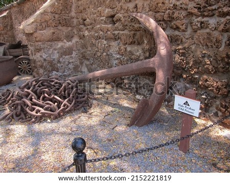 Old rusty anchor and its chains at the historic site Hale Pa'ahao (stuck-in-irons house), old Lahaina prison, today a museum, at Maui, Hawaii. 