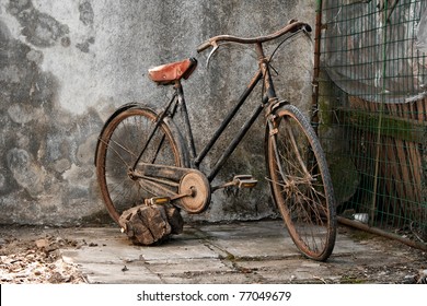 old rusty bicycle over a grunge background