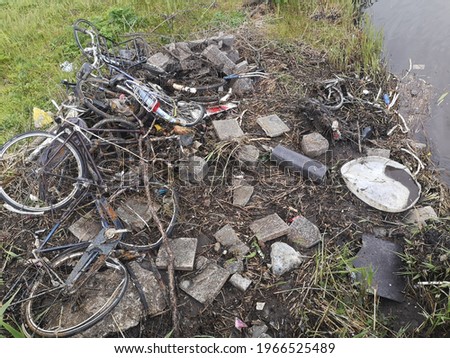 Old rusty bicycles pulled from a canal in Amsterdam. 