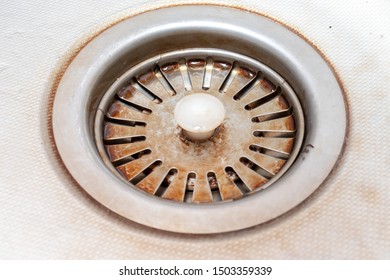 Old Rusty Calcified Drain Hole In The Kitchen Sink With Limescale And Scurf Scum.