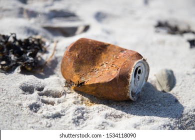 A Old Rusty Can On The Beach