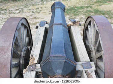 Old Rusty Cannon Or Artillery Gun On Wheels As New Cold War Concept.