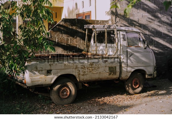old rusty\
car not maintained, Yogyakarta,\
Indonesia