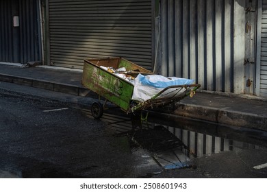 Old rusty cart parked on sidewalk - Powered by Shutterstock