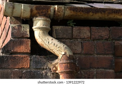 Old Rusty Cast Iron Gutter And Drain Pipe