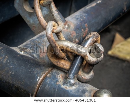 Old and rusty chain link of industrial vehicle, selective focus(Color filtered effect)