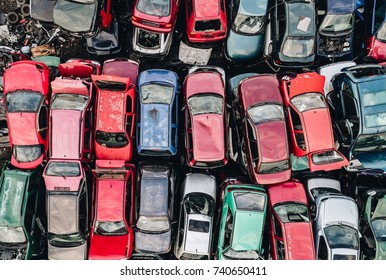 Old rusty corroded cars in car scrapyard. Car recycling - Shutterstock ID 740650411