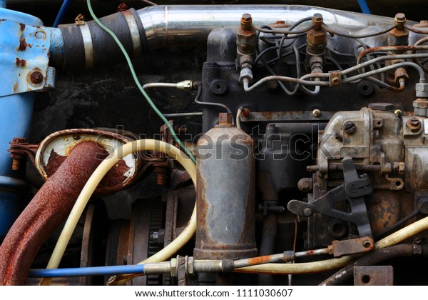 Old\
rusty diesel engine. Old engine and dirty auto\
parts.