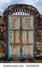 Old Rusty Door With Pad Locks And Rock Arch At Historical Palace Of The Fon, Bafut, Cameroon, Africa