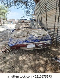 Old rusty and dusty car parked in the street. Blue old car. - Shutterstock ID 2213675593