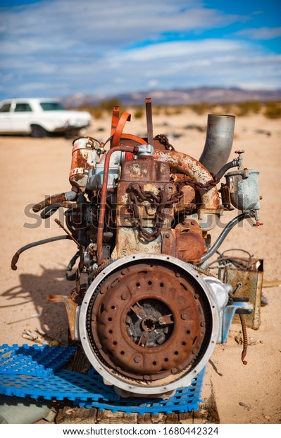 Old rusty engine\
in a Mojave desert junkyard