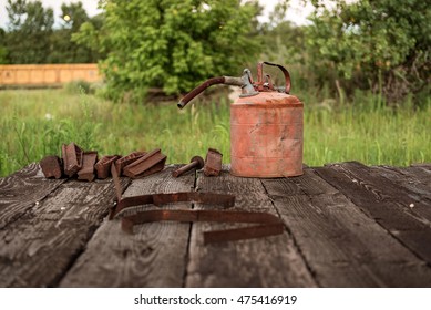 Old, Rusty Gas Can I Train Yard With Rusted Metal Pieces.