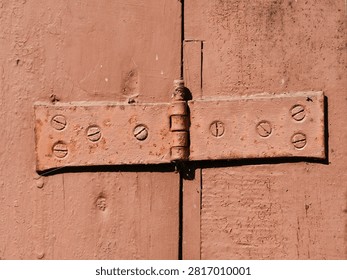 old, rusty gate hinge background