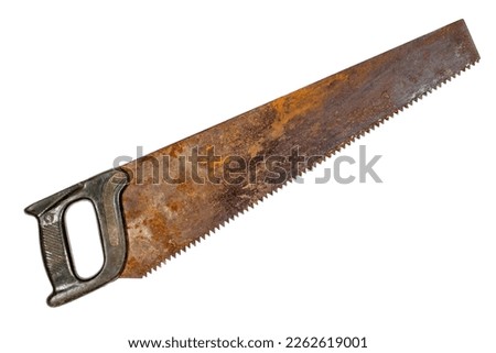 An old rusty hacksaw for sawing wood. Rusty saw close-up.