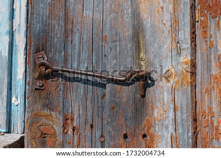 Old And Rusty Hook Locks The Old Dried Up Wooden Barn Door