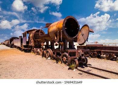 Old rusty locomotive abandoned in the train cemetery of Uyuni, Bolivia - Shutterstock ID 1969431649