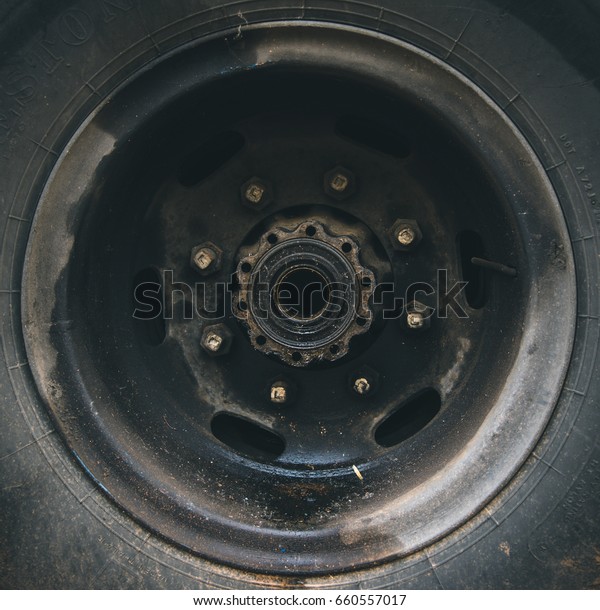 old rusty\
metal alloy wheel car vintage\
style.
