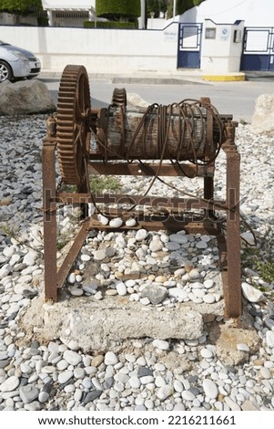 Old Rusty metal boat winch at Altea Beach, Alicante, Spain