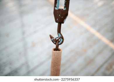 Premium Photo  Metal hook hanging on chain