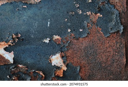 Old Rusty Metal Sheet With Peeling Dark Blue Paint, Grunge Background Or Texure 