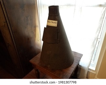 Old Rusty Metal Sibley Stove On Table