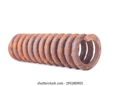 Old rusty metallic spring on white background.
