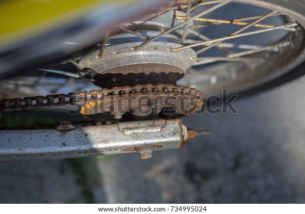 Old rusty\
motorcycle, chain, brake, shock\
absorber
