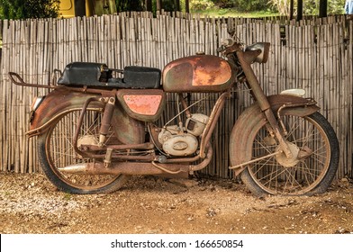 The Old, Rusty Motorcycle On A Street