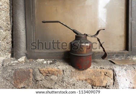 old rusty oil can