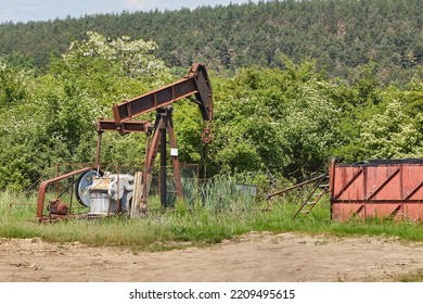 Old Rusty Oil Well On A Field