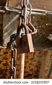 Old Rusty Padlock On Chain