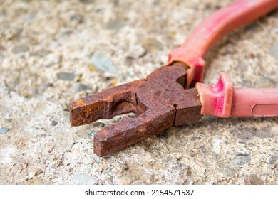 Old Rusty Pliers. Closeup Photo Of Aged Red Pliers.