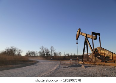 Old Rusty Pump Jack In The Oilfield In Texas