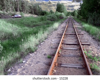The old rusty rails next to the mean of transportation that replaced it.