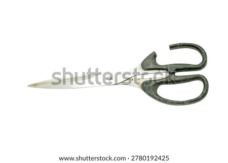 Old rusty scissors with black handles on a white background.
