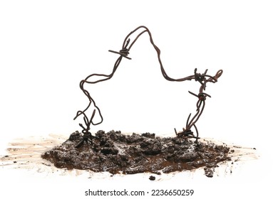 Old rusty security barbed wire fence in wet mud isolated on white