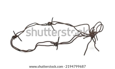 Old rusty security barbed wire fence isolated on white  