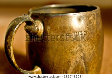 old rusty silver mug with British hallmarks	
