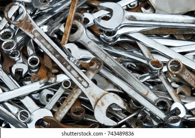 Old Rusty Spanners And Wrenches In A Large Pile In A Toolbox